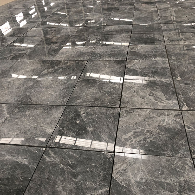 What are the steps involved in properly installing marble tiles?