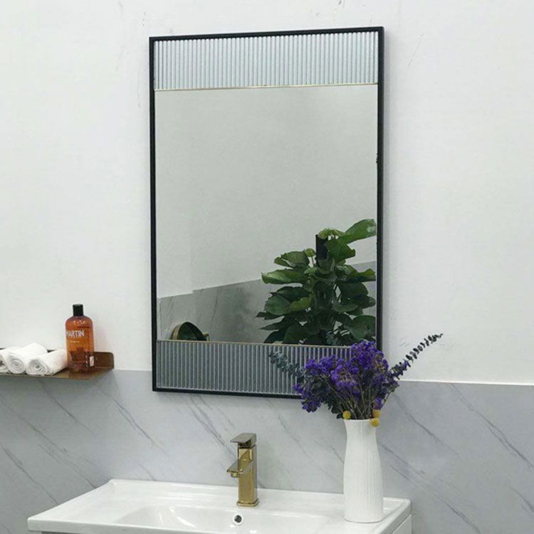 How is the Black Metal Frame Bathroom Mirror installed?